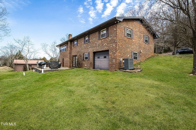 rear view of property featuring a chimney, a lawn, and central air condition unit