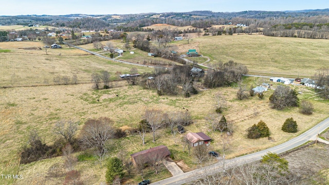 birds eye view of property with a rural view