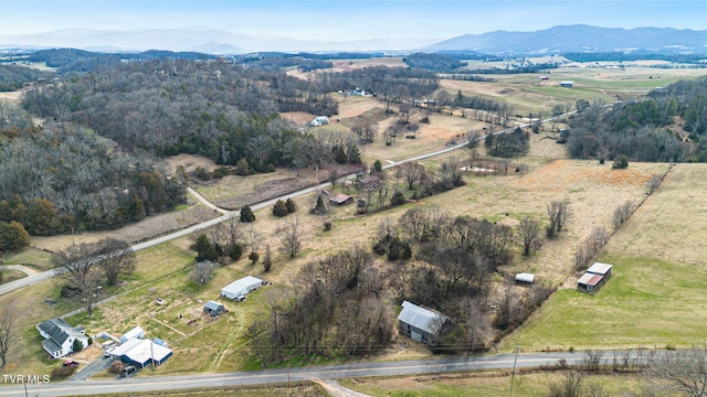 drone / aerial view featuring a rural view and a mountain view