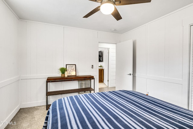 bedroom featuring a decorative wall and a ceiling fan