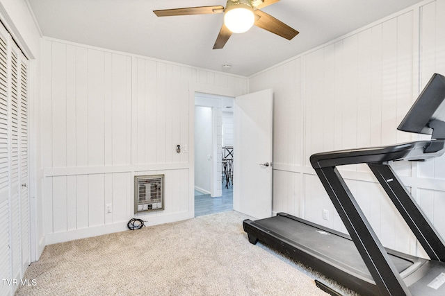 workout area with ceiling fan and carpet flooring