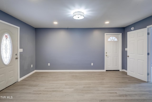 entryway featuring light wood finished floors, recessed lighting, and baseboards