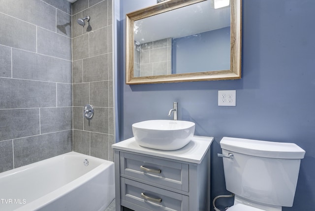 full bathroom featuring toilet, shower / washtub combination, and vanity