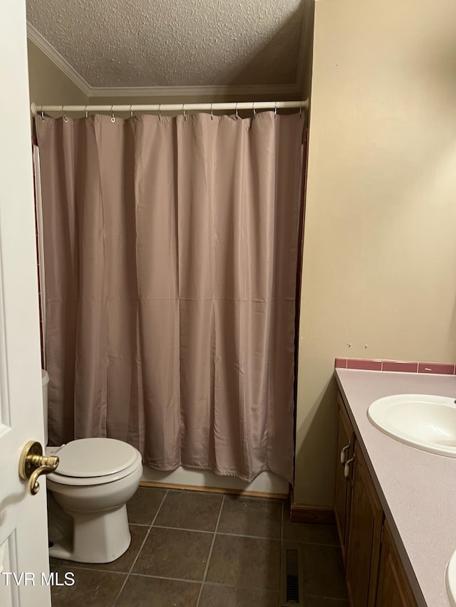 full bath with visible vents, toilet, tile patterned flooring, a textured ceiling, and vanity