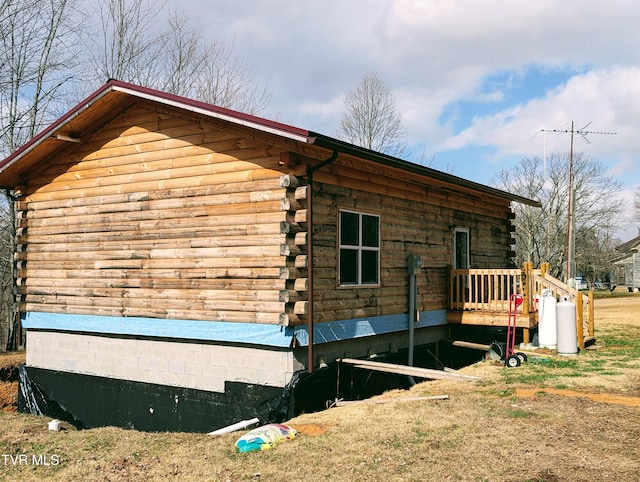 view of property exterior featuring log exterior