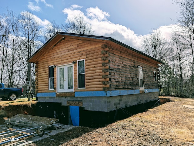 view of home's exterior featuring log siding