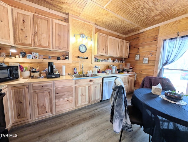 kitchen featuring a sink, wood walls, black microwave, wooden ceiling, and dishwasher