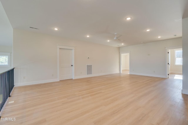 empty room with recessed lighting, visible vents, ceiling fan, and light wood-style flooring