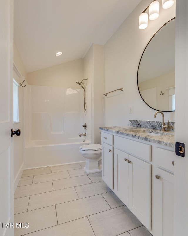 full bath with toilet, shower / bathtub combination, tile patterned floors, vaulted ceiling, and vanity