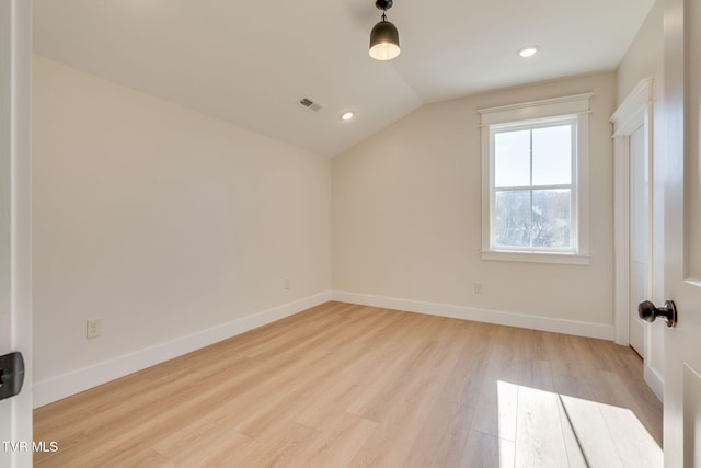 bonus room with light wood-type flooring, visible vents, lofted ceiling, and baseboards