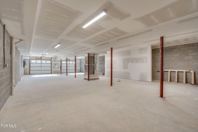 basement with concrete block wall