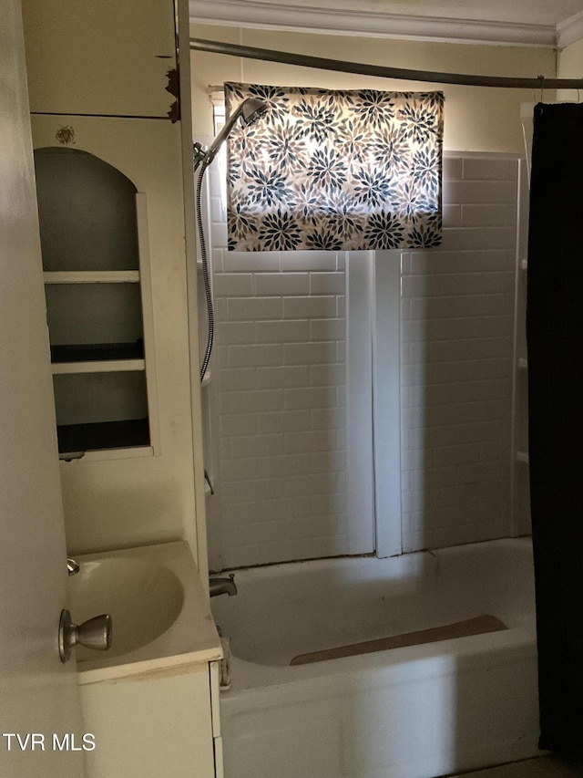 full bathroom with ornamental molding, tub / shower combination, and a sink