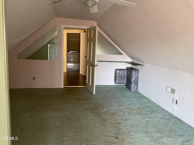 bonus room with a ceiling fan, lofted ceiling, and carpet floors