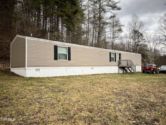 view of home's exterior with a lawn