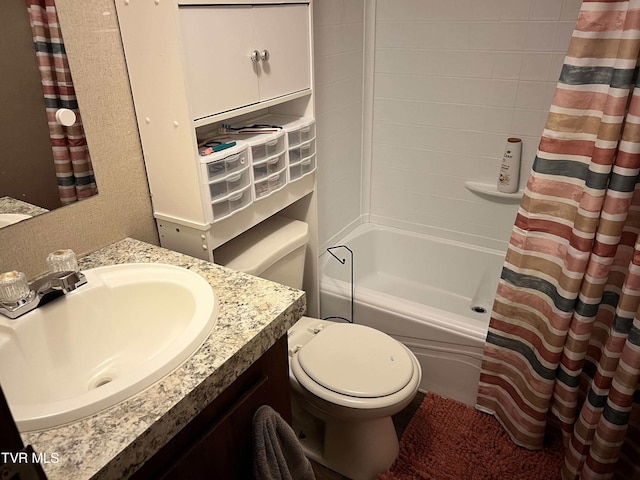 bathroom with vanity, toilet, and shower / tub combo with curtain