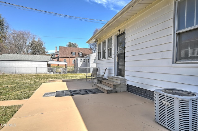 view of patio featuring cooling unit, fence, and entry steps