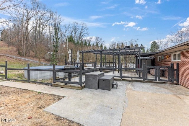 view of patio featuring fence and a pergola