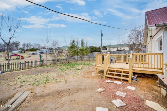 view of yard featuring a fenced backyard and a deck