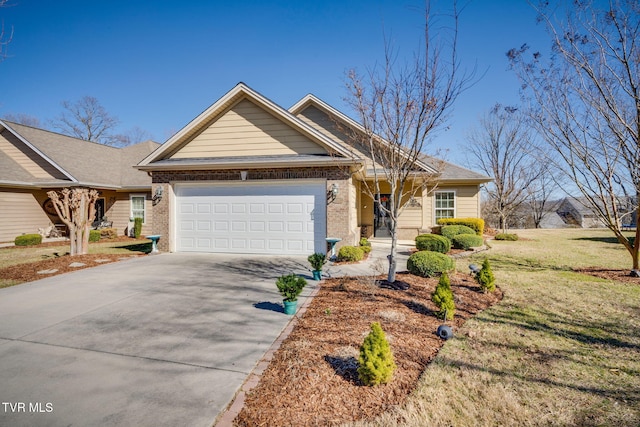 view of front facade with driveway, a front yard, a garage, and brick siding