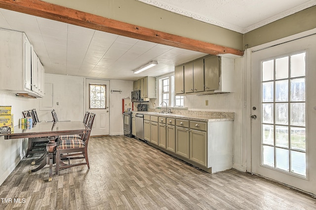 kitchen with gray cabinets, stove, a sink, and light wood-style floors