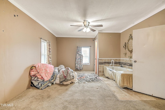 bathroom featuring plenty of natural light, a textured ceiling, and crown molding