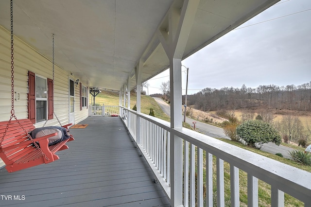 wooden terrace with a porch