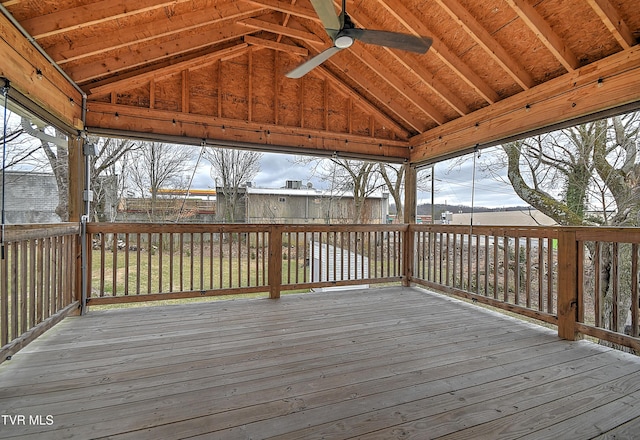 wooden deck with a ceiling fan