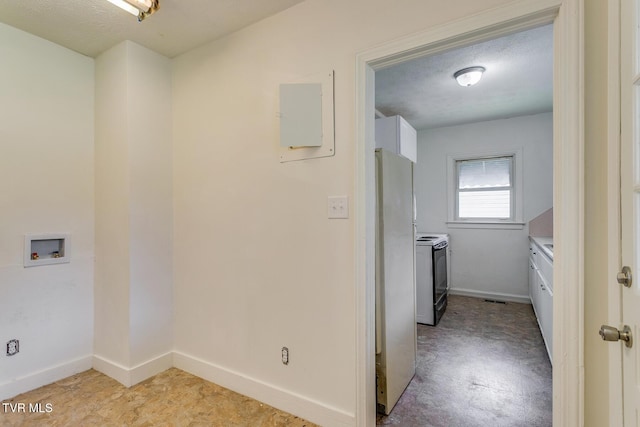 laundry room with visible vents, baseboards, laundry area, electric panel, and a textured ceiling