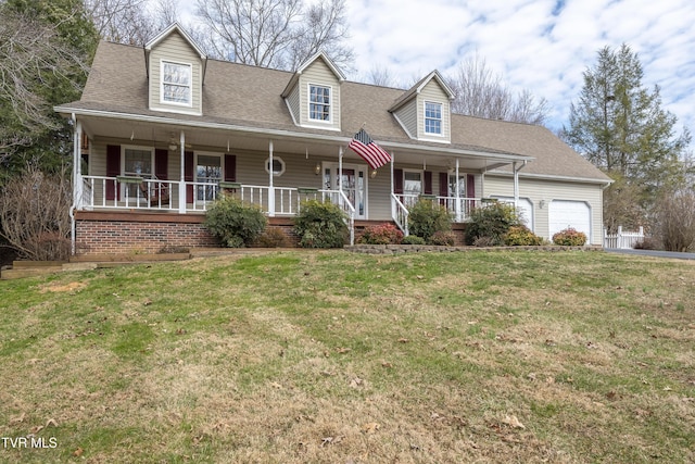 new england style home with an attached garage, a porch, a front lawn, and a shingled roof