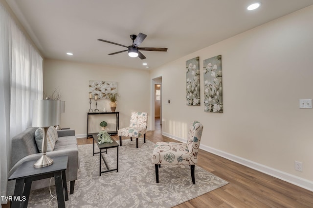 living room with recessed lighting, baseboards, wood finished floors, and a ceiling fan