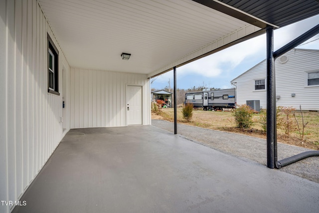 view of patio / terrace with an attached carport and central AC unit