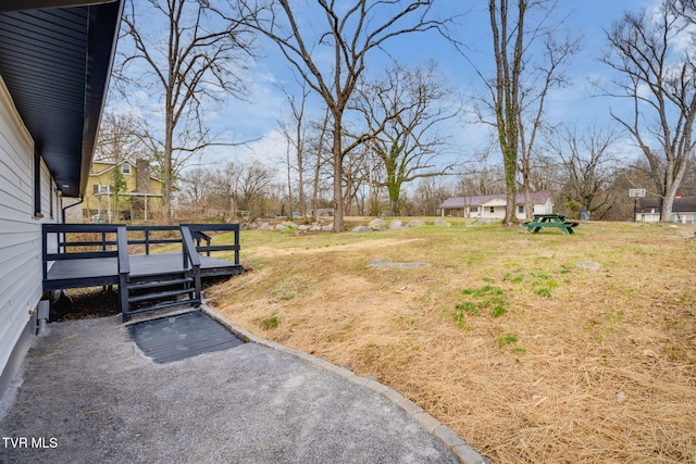 view of yard with a wooden deck