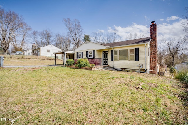 view of front of home with a chimney, fence, and a front lawn