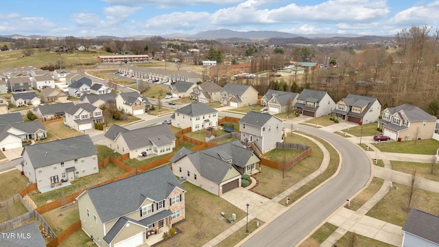 drone / aerial view with a residential view and a mountain view