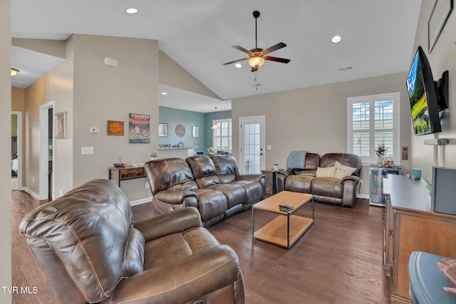 living area with lofted ceiling, recessed lighting, a ceiling fan, baseboards, and dark wood-style floors