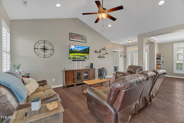 living room featuring dark wood-style floors, lofted ceiling, visible vents, and baseboards