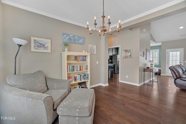 sitting room featuring crown molding, baseboards, and wood finished floors