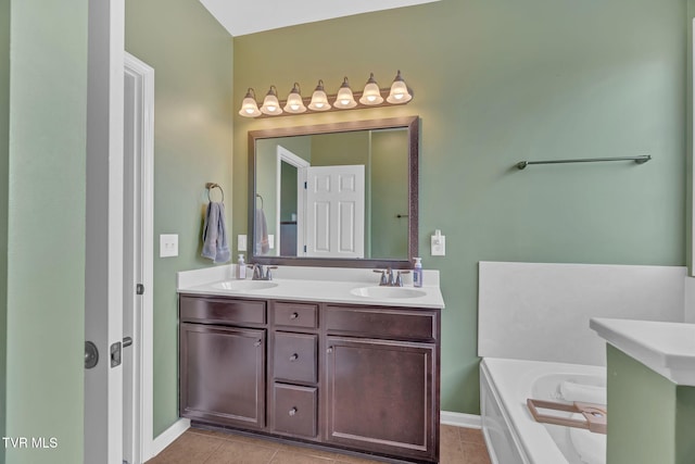 bathroom with a washtub, tile patterned floors, a sink, and double vanity