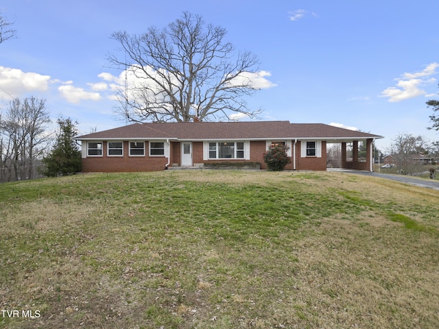 single story home with driveway, a front lawn, a carport, and brick siding