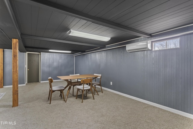 carpeted dining room featuring an AC wall unit, beamed ceiling, and baseboards