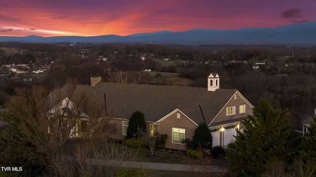 aerial view at dusk with a mountain view