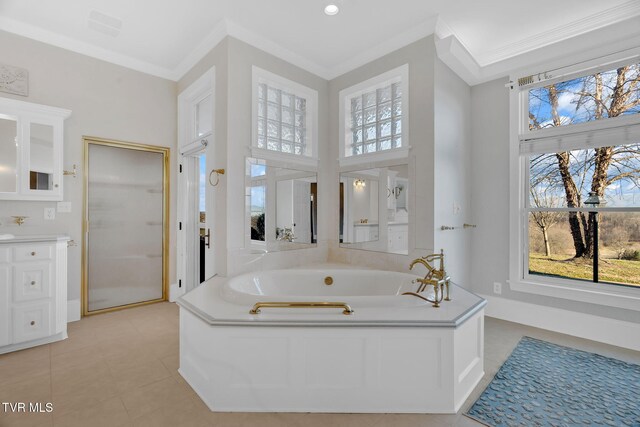 full bathroom with crown molding, tile patterned flooring, a garden tub, and a healthy amount of sunlight