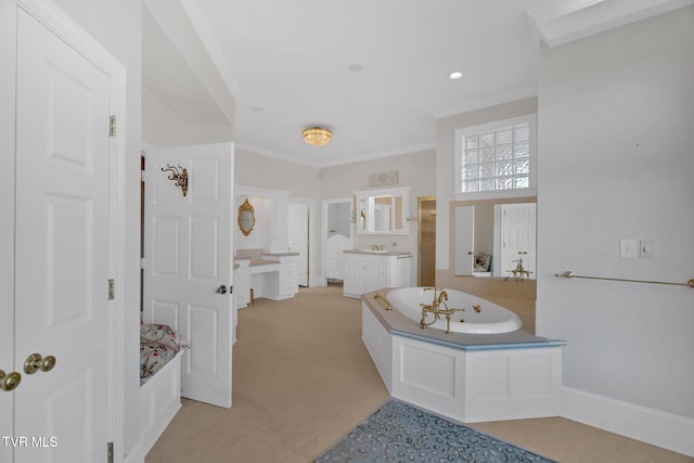 bathroom featuring baseboards, tile patterned flooring, crown molding, vanity, and a bath