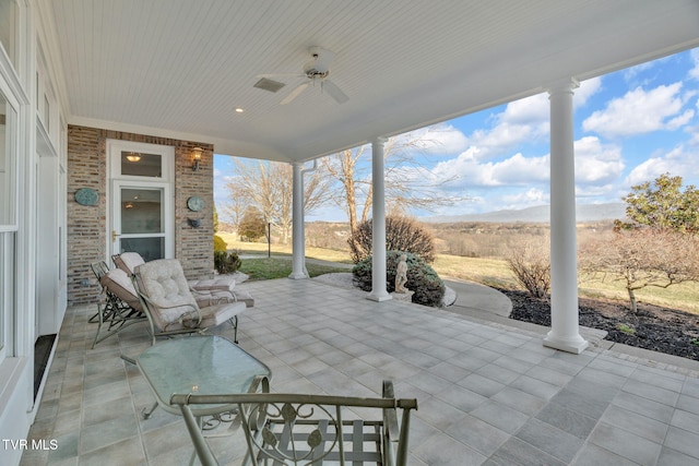 view of patio featuring ceiling fan