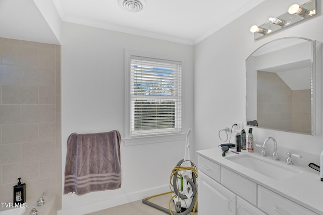 full bathroom featuring ornamental molding, vanity, visible vents, and baseboards