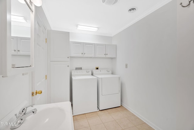 bathroom with separate washer and dryer, a sink, visible vents, tile patterned floors, and crown molding