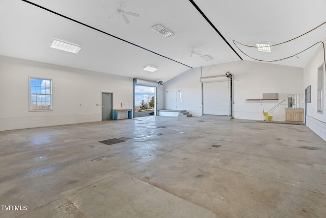 garage with a ceiling fan and electric panel