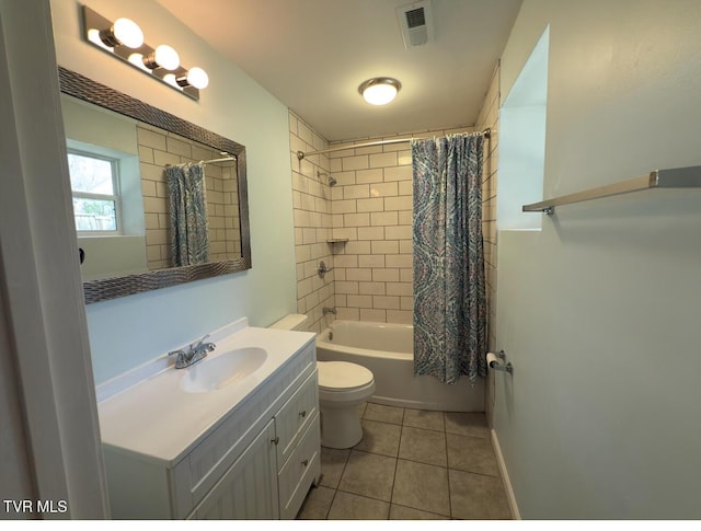 bathroom featuring visible vents, toilet, shower / tub combo, tile patterned floors, and vanity