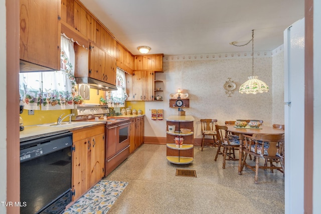 kitchen featuring wallpapered walls, light countertops, black dishwasher, stove, and a sink