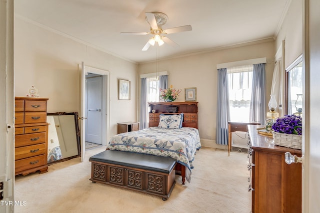 bedroom with light carpet, baseboards, a ceiling fan, and ornamental molding